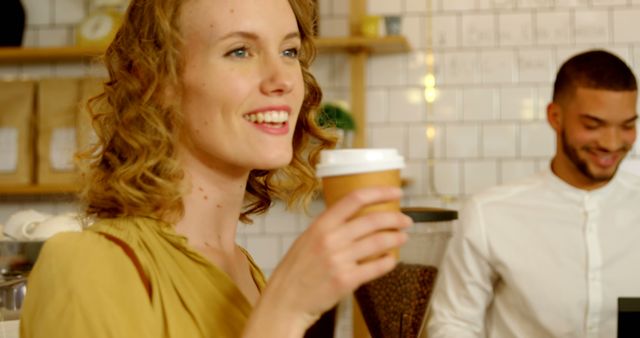 Smiling Woman Enjoying Coffee in a Café - Download Free Stock Images Pikwizard.com