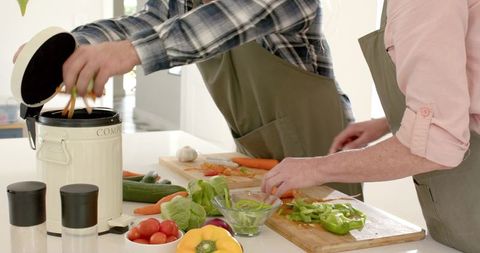 Senior Couple Practicing Sustainability in Modern Kitchen