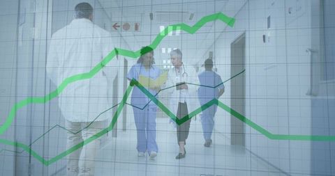 Medical Team Walking Hospital Corridor with Green Analytics Overlay Showing Workflow Trends