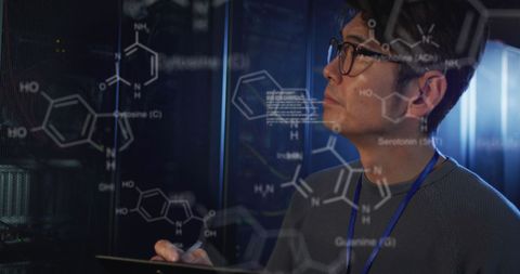 Engineer Analyzing Complex Chemical and Data Structures in Server Room - Download Free Stock Images Pikwizard.com