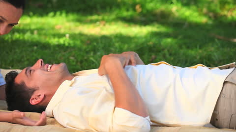 Joyful Couple Relaxing in Sunny Park
