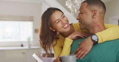 Happy Couple Enjoying Coffee at Home Embracing Love and Romance