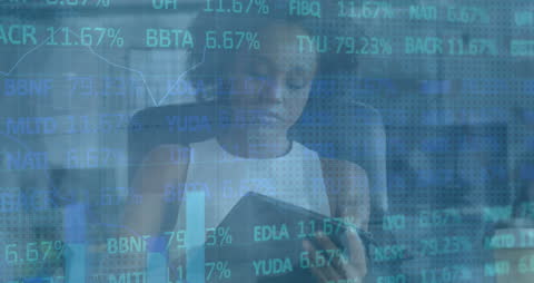 African American Businesswoman Analyzing Financial Data on Tablet