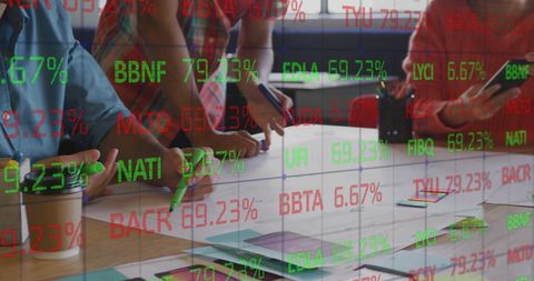 Diverse Team Collaborating with Stock Market Data Overlay