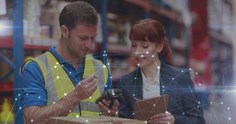 Warehouse team scanning inventory with handheld scanner and tablet, network overlay