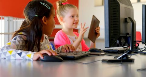 Diverse Schoolgirls Learning on Computers Together in Classroom - Download Free Stock Images Pikwizard.com