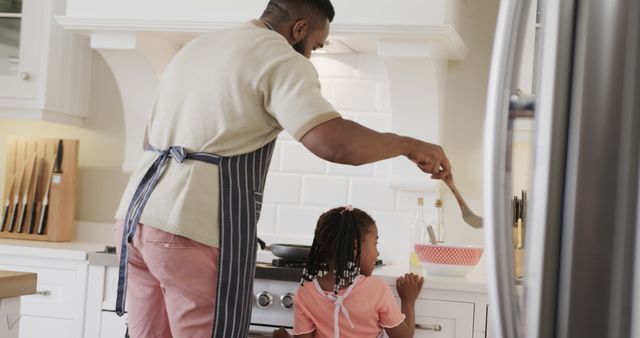 Happy African American Father And Daughter Cooking Together In Modern Kitchen - Download Free Stock Images Pikwizard.com