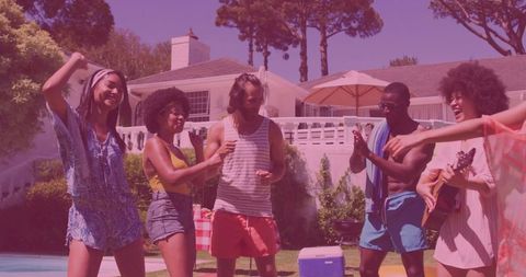 Friends dancing poolside celebrating vibrant outdoor gathering