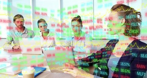 Business Team Analyzing Stock Market Trends with Digital Tablet