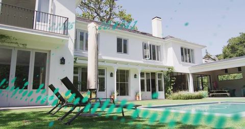 Modern two-story white home with pool and lounge chairs, balcony, teal graphic streaks