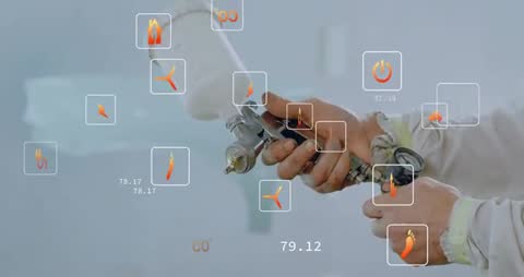 Technician Adjusting Spray Gun with Virtual Energy Icons Overlay
