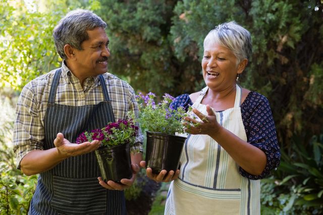 Happy Senior Couple Gardening Together - Download Free Stock Photos Pikwizard.com