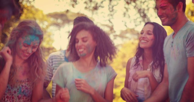 Joyful Friends Celebrating with Colorful Powder Outdoors - Download Free Stock Images Pikwizard.com