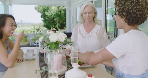 Enjoying Leisurely Brunch Outdoors with Refreshing Beverages and Fair Skies