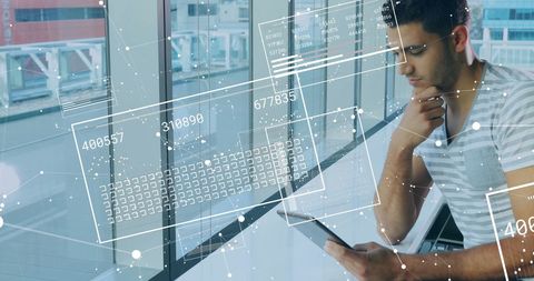 Businessman Engaged in Digital Data Processing in Modern Office