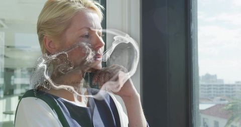 Reflective Professional in Modern Office with Overlay of Science Imagery