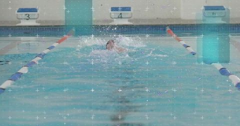 Swimmer in action at competition lap in aquatic center