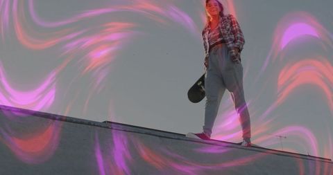 Skater in Flannel Enjoying Vibrant Urban Ramp Experience
