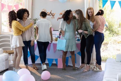 Diverse group of women celebrating joyful baby shower