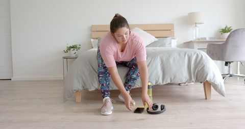 Plus size woman preparing for home workout