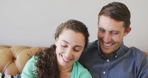 Happy Couple Smiling Together and Enjoying Leisure Time at Home
