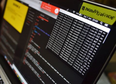 Laptop screen displaying coding terminal and program