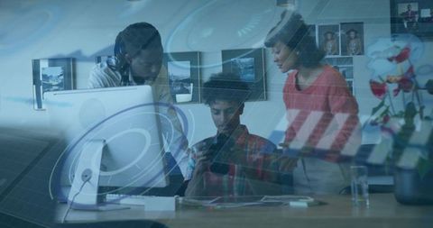 Creative team discussing digital design in modern office