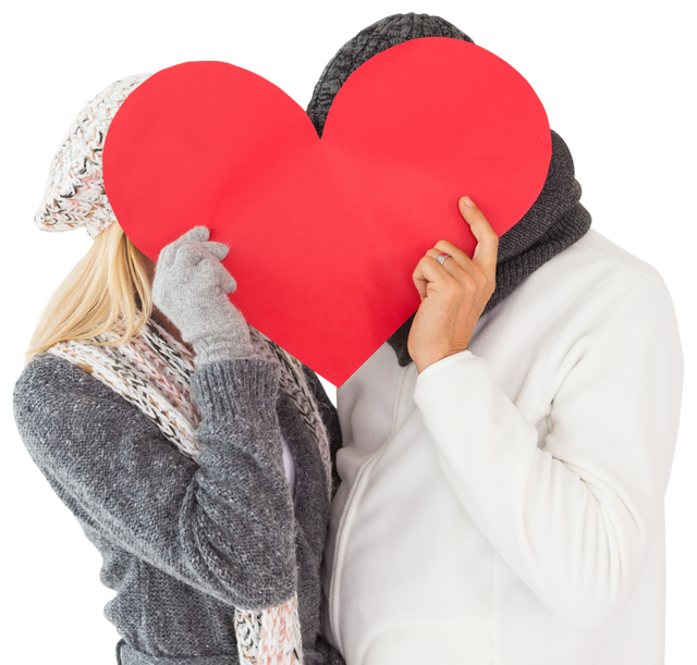 Couple behind large red heart, wearing winter attire on transparent background - Download Free Stock Videos Pikwizard.com