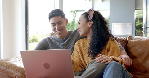 Diverse Couple Sofa Bonding with Laptop Show Modern Living