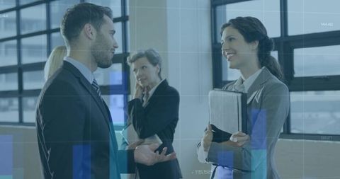 Colleagues networking in bright modern office with financial data overlays and teamwork