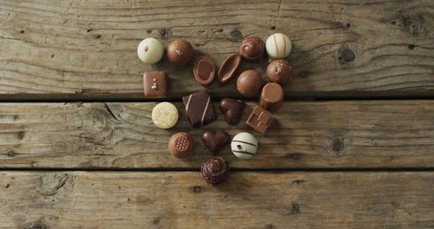 Heart Shaped Chocolate Assortment on Rustic Wooden Surface - Download Free Stock Images Pikwizard.com