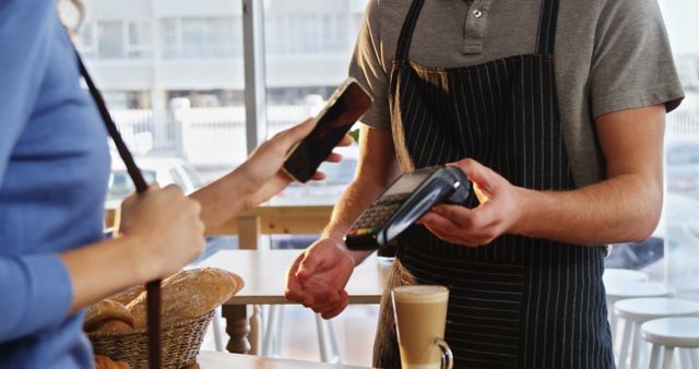 Customer Using Mobile Payment at Bakery Cafe - Download Free Stock Photos Pikwizard.com