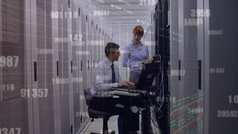 Server Room Technicians Analyzing Network Data