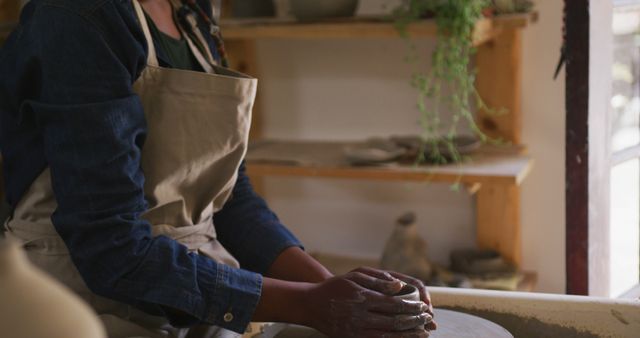 Woman Shaping Pottery Clay on Wheel in Studio - Download Free Stock Images Pikwizard.com