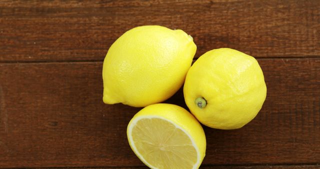 Fresh Ripe Yellow Lemons on Wooden Surface - Download Free Stock Photos Pikwizard.com