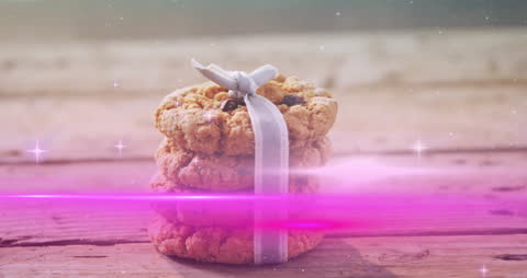 Stacked Chocolate Chip Cookies with Ribbon on Wood