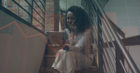 Biracial Businesswoman Analyzing Financial Data on Tablet on Stairs - Download Free Stock Images Pikwizard.com