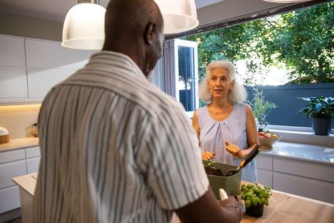 Senior couple preparing meal together amateur