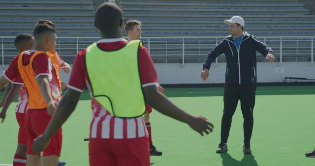 Soccer Coach Instructing Teenage Players During Practice Sessions on Field - Download Free Stock Images Pikwizard.com