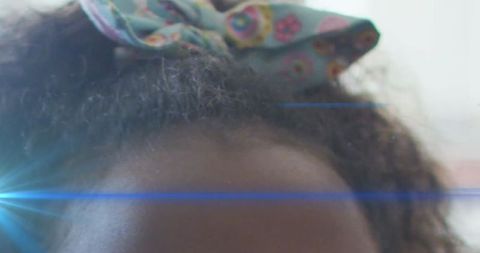 Creative digital effects on young african american girl's forehead