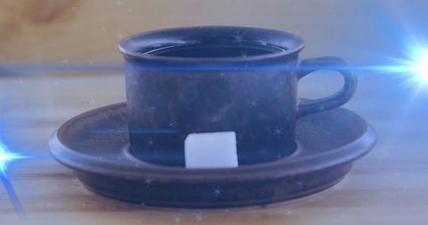 Rustic charm with metal cup and saucer featuring sugar cube