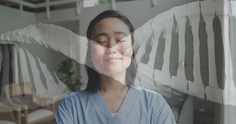 Asian female doctor with dna helix overlay