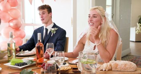 Newlyweds celebrating wedding at intimate home ceremony