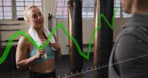 Woman in gym with graph overlay showing fitness progress