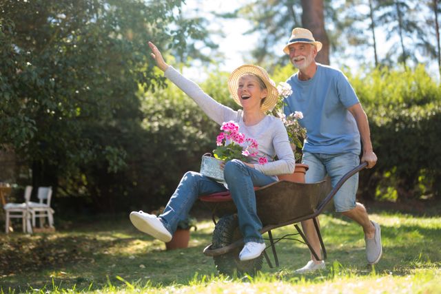Senior Couple Enjoying Gardening with Wheelbarrow on Sunny Day - Download Free Stock Photos Pikwizard.com