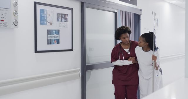 Nurse Assisting Young Female Patient in Hospital Corridor - Download Free Stock Images Pikwizard.com