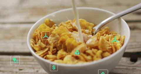 Pouring Milk Into Bowl of Corn Flakes with Eco and Finance Icons, Rustic Breakfast Macro
