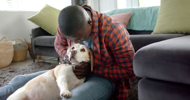 Young Man Cuddling with His Adorable Pet Dog at Home - Download Free Stock Images Pikwizard.com