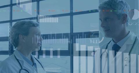 Doctors analyzing data with innovative technology in research lab