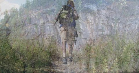 Hiker Exploring Mountain Trail with Backpack and Walking Poles